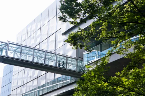 Bridge between two buildings suggesting a walled off trading desk