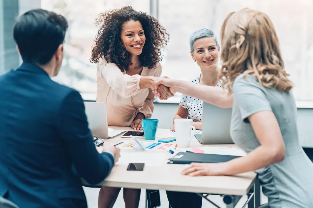 Business persons handshaking on a business meeting