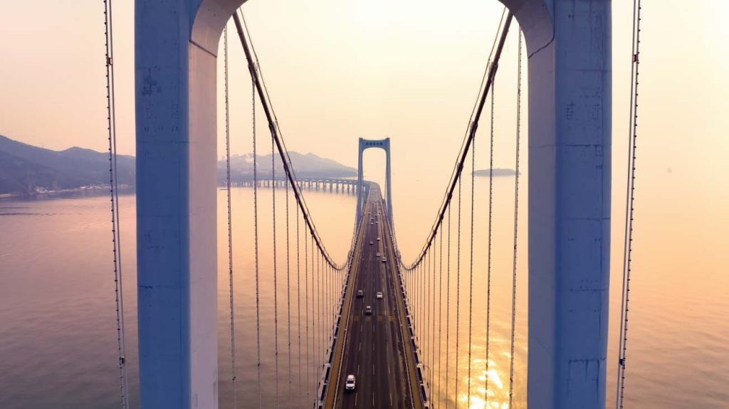 View from top of suspension bridge at dawn